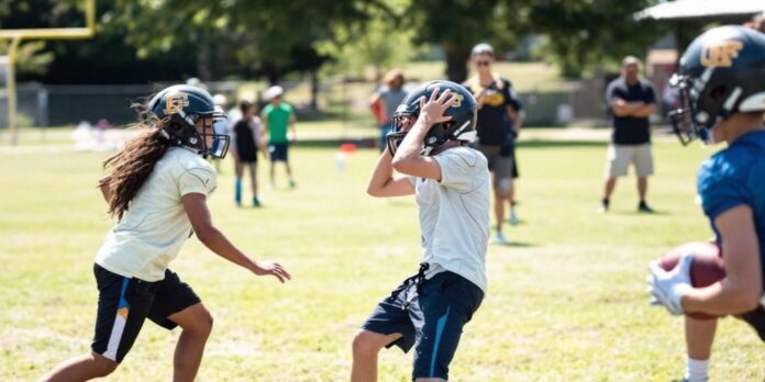 Youth-football-players-training-on-a-sunny-field.